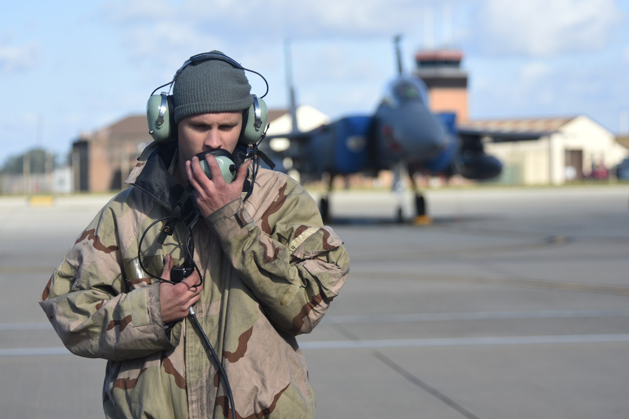 An Airman assigned to the 492nd Fighter Squadron communicates with pilots before departure during the “FURIOUS 48” readiness exercise at Royal Air Force Lakenheath, England, Oct. 1, 2018. Exercises like this provide both aircrew and support personnel stationed at RAF Lakenheath the experience needed to maintain a ready force capable of ensuring the collective defense of the NATO alliance. (U.S. Air Force photo by Airman 1st Class Christopher S. Sparks)