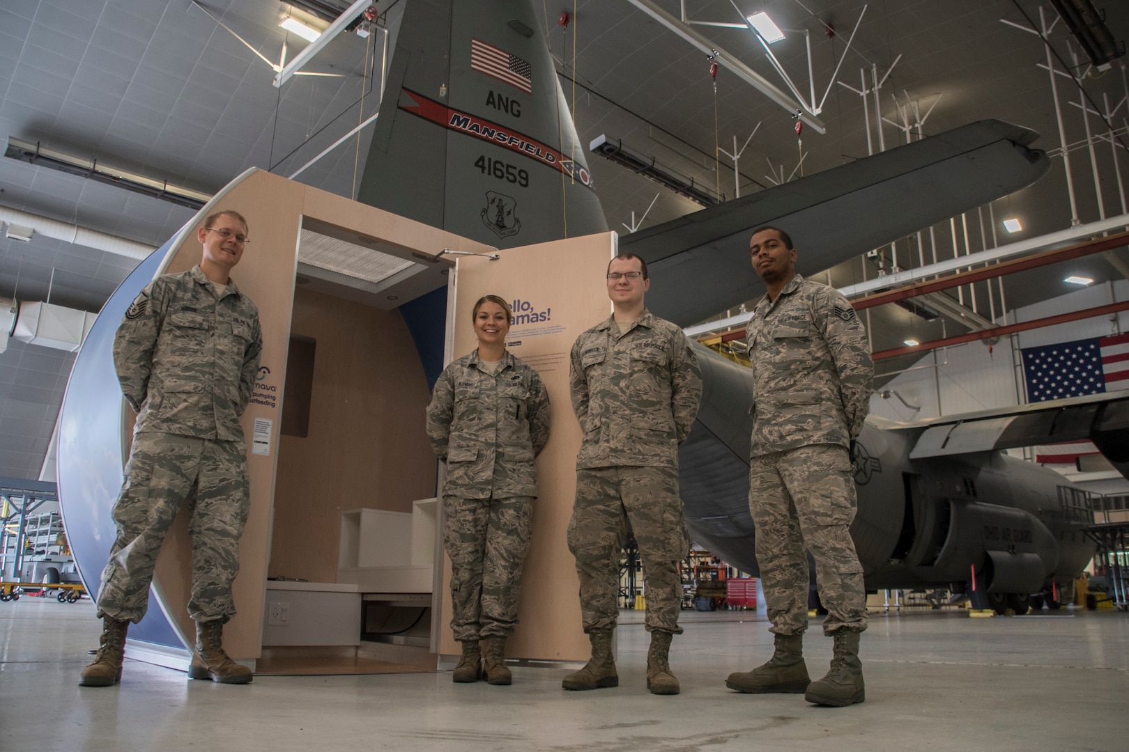 Master Sgt. Cortney R. Fleming, assigned to the 179th Airlift Wing Maintenance Group, assembles the Mamava Lactation pod with support of fellow Airmen Oct. 1, 2018, at the 179th Airlift Wing, Mansfield, Ohio. Mamava Lactation Pods are designed to provide mothers a private, clean, comfortable place to pump and breastfeed.