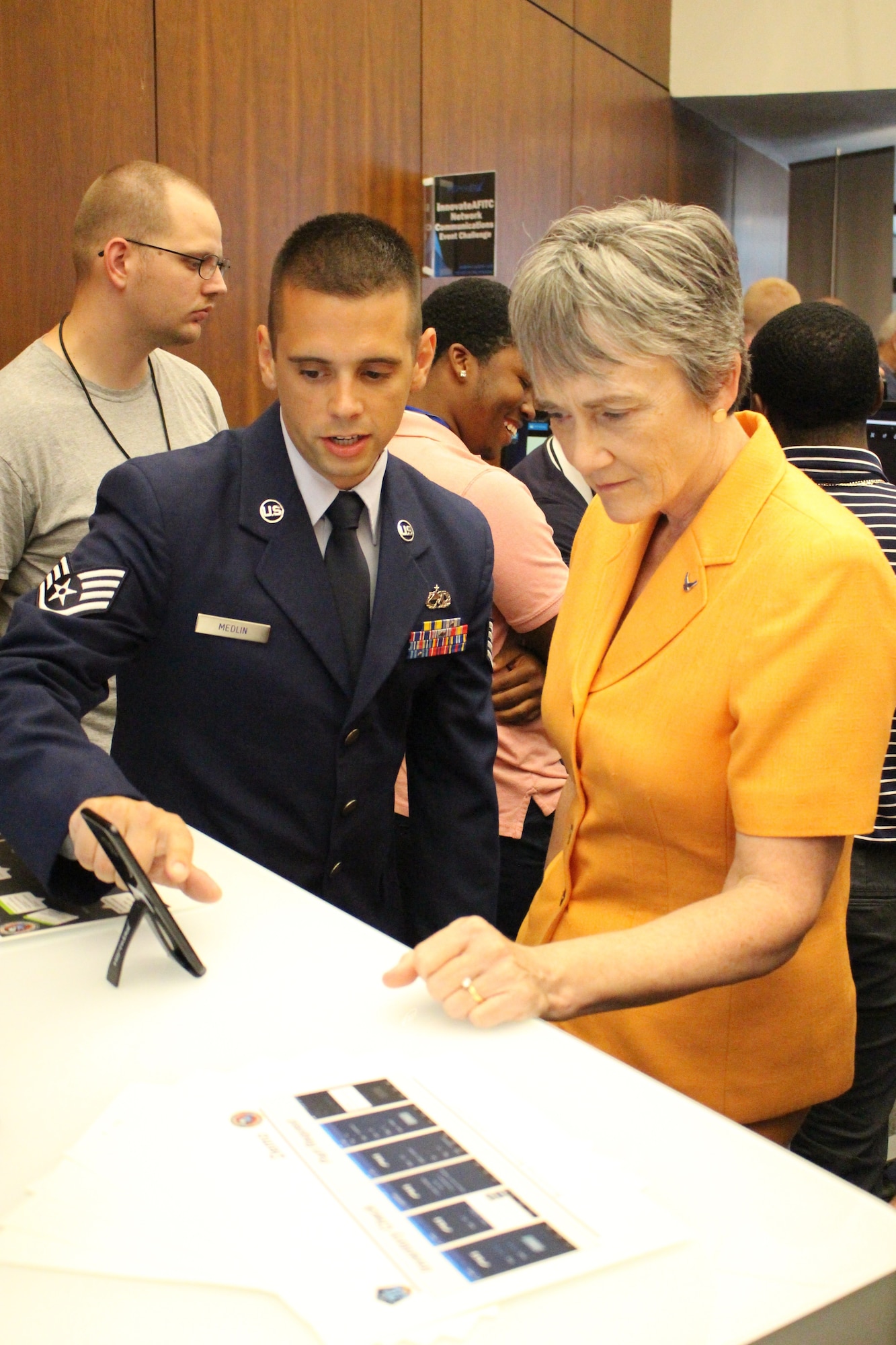 Staff Sgt. Sean Medlin (left), Lead Android Developer for the Business and Enterprise Systems Directorate, explains the directorate's first mobile application prototype to the Secretary of the Air Force, Dr. Heather Wilson, during the Air Force Information Technology Conference in Montgomery, Ala., in August 2018. (U.S. Air Force photo / Ryan McCain)