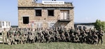 Hungarian, Serbian and Ohio National Guard Soldiers gather for a group photo Sept. 20, 2018, after the culminating training event during Exercise Neighbors 2018 in Ujdorogd, Hungary.