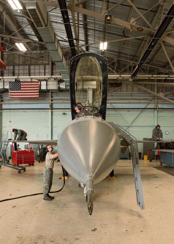 U.S. Air Force aircraft maintainers assigned to the 158th Fighter Wing, perform maintenance checks on Aircraft 328 during a phase inspection at the Vermont Air National Guard Base, August 1, 2018. Aircraft 328 was the last F-16 to undergo a phase inspection as the unit transitions to the F-35 Lightning II in fall of 2019. (U.S. Air National Guard photo by 2nd. Lt. Chelsea Clark)