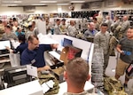 Airmen at Aviano Air Base, Italy filled the Army and Air Force Exchange Service sales store to purchase the Operational Camouflage Pattern utility uniform October 1, 2018. DLA Troop Support Clothing and Textiles worked with its Air Force counterparts and other key stakeholders since April to ensure more than 17,000 uniforms were delivered to five military clothing sales stores, including Aviano Air Base, Shaw Air Force Base, South Carolina, the Pentagon, Washington, D.C., Joint Base Charleston, South Carolina and MacDill AFB, Florida for the initial fielding.