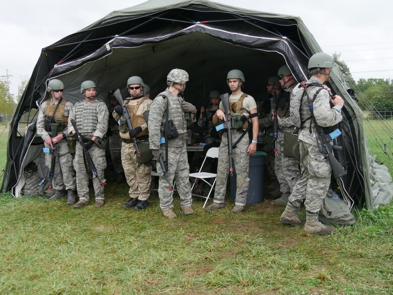 Participants take a break from field training activities during Operation Tech Warrior 2018. Air Force instructors lead these exercises, which replicate military missions and tactics for the battlefield. (U.S. Air Force photo/Kenneth McNulty)