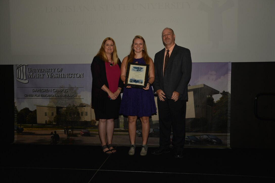 IMAGE: DAHLGREN, Va. (Sept. 21, 2018) – Ruby Clancy receives her certificate of achievement from Naval Surface Warfare Center Dahlgren Division (NSWCDD) Acting Chief of Staff Terri Gray and Acting Deputy Technical Director Chris Clifford at the 2018 NSWCDD Academic Recognition Ceremony.