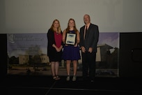 IMAGE: DAHLGREN, Va. (Sept. 21, 2018) – Ruby Clancy receives her certificate of achievement from Naval Surface Warfare Center Dahlgren Division (NSWCDD) Acting Chief of Staff Terri Gray and Acting Deputy Technical Director Chris Clifford at the 2018 NSWCDD Academic Recognition Ceremony.
