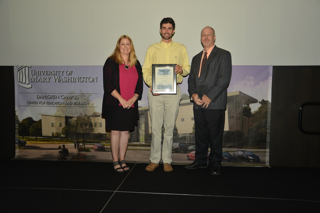 IMAGE: DAHLGREN, Va. (Sept. 21, 2018) – Kyle Dalton receives his certificate of achievement from Naval Surface Warfare Center Dahlgren Division (NSWCDD) Acting Chief of Staff Terri Gray and Acting Deputy Technical Director Chris Clifford at the 2018 NSWCDD Academic Recognition Ceremony.