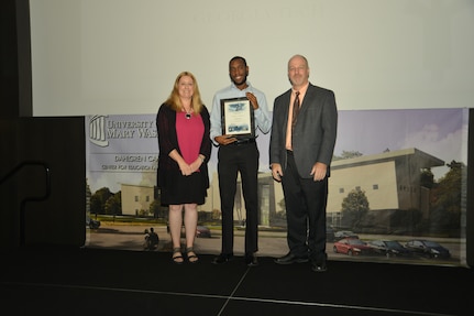 IMAGE: DAHLGREN, Va. (Sept. 21, 2018) – Brandon Gipson receives his certificate of achievement from Naval Surface Warfare Center Dahlgren Division (NSWCDD) Acting Chief of Staff Terri Gray and Acting Deputy Technical Director Chris Clifford at the 2018 NSWCDD Academic Recognition Ceremony.