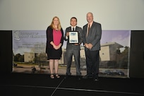 IMAGE: DAHLGREN, Va. (Sept. 21, 2018) – Daniel Apolinar receives his certificate of achievement from Naval Surface Warfare Center Dahlgren Division (NSWCDD) Acting Chief of Staff Terri Gray and Acting Deputy Technical Director Chris Clifford at the 2018 NSWCDD Academic Recognition Ceremony.