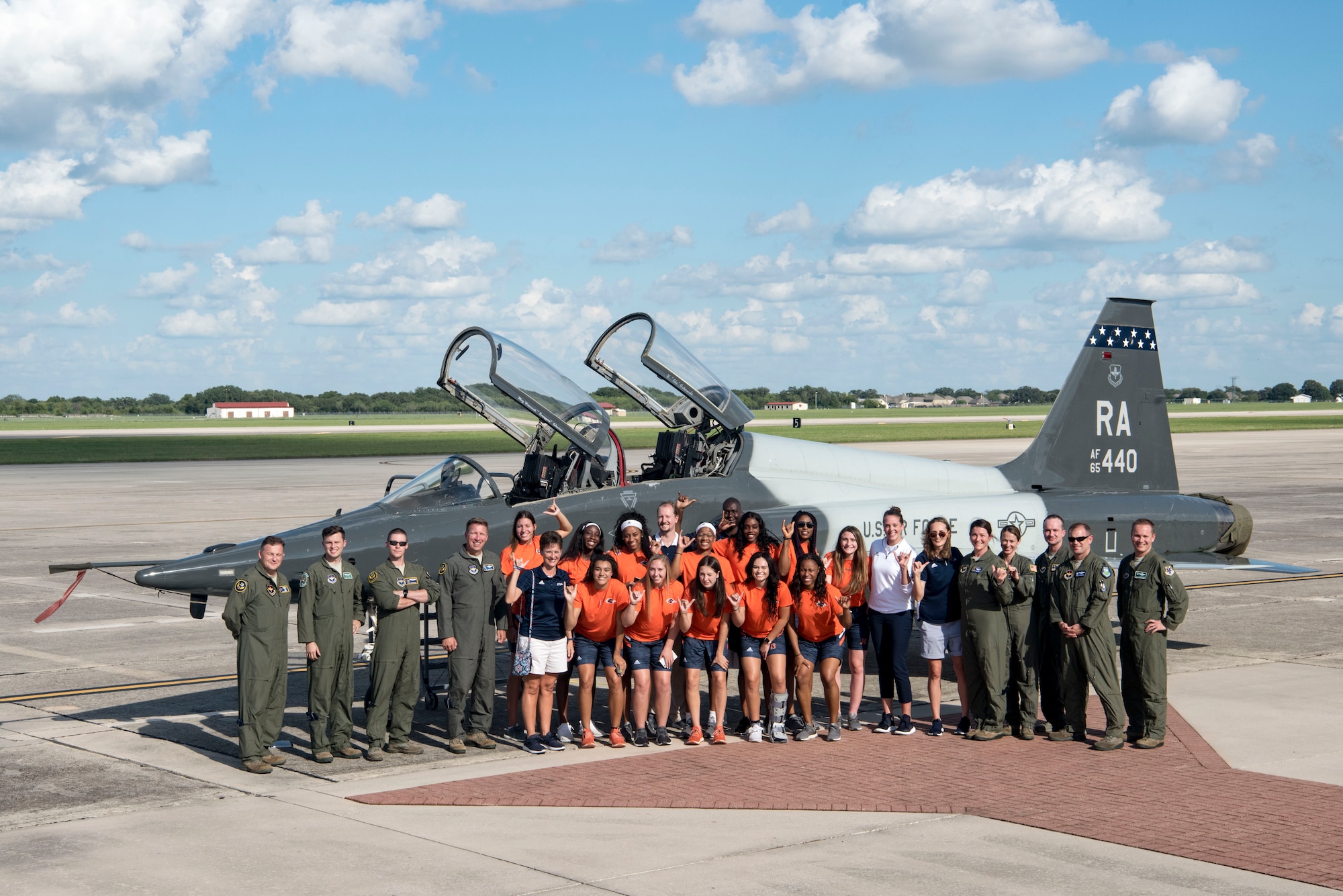 Members of the University of Texas San Antonio Women’s Basketball Team pose for a photo with Maj. Gen. Patrick Doherty, 19th Air Force commander, and members of the 560th Flying Training Squadron Sept. 25, 2018, at Joint Base San Antonio-Randolph, Texas. The UTSA Women’s Basketball Team visited JBSA-Randolph to speak to Airmen about the importance of teamwork and commitment. (U.S. Air Force photo by Senior Airman Stormy Archer)