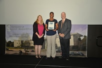 IMAGE: DAHLGREN, Va. (Sept. 21, 2018) – Dominique Nelson receives her certificate of achievement from Naval Surface Warfare Center Dahlgren Division (NSWCDD) Acting Chief of Staff Terri Gray and Acting Deputy Technical Director Chris Clifford at the 2018 NSWCDD Academic Recognition Ceremony.