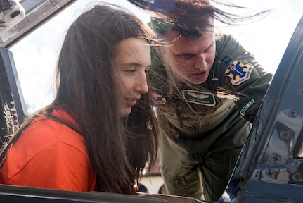 Charlotte Elmore, University of Texas San Antonio Women’s Basketball Team player, sits in the cockpit of a T-38C Talon while Capt. Josh Thompson, 560th Flying Training Squadron instructor pilot, explains the controls Sept. 25, 2018, at Joint Base San Antonio-Randolph, Texas. The T-38C Talon is a twin-engine, high-altitude, supersonic jet trainer used in a variety of roles because of its design, economy of operations, ease of maintenance, high performance and exceptional safety record. (U.S. Air Force photo by Senior Airman Stormy Archer)