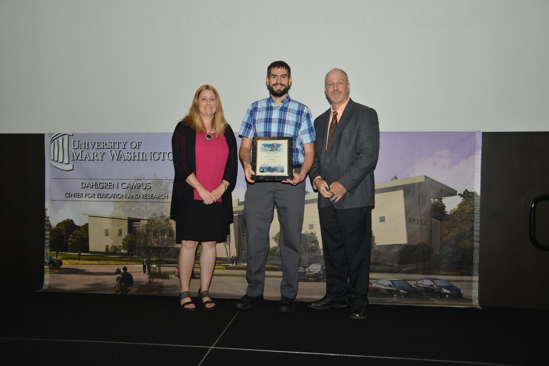 IMAGE: DAHLGREN, Va. (Sept. 21, 2018) – Brian Bowser receives his certificate of achievement from Naval Surface Warfare Center Dahlgren Division (NSWCDD) Acting Chief of Staff Terri Gray and Acting Deputy Technical Director Chris Clifford at the 2018 NSWCDD Academic Recognition Ceremony.