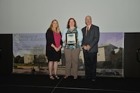IMAGE: DAHLGREN, Va. (Sept. 21, 2018) – Evelyn Peyton receives her certificate of achievement from Naval Surface Warfare Center Dahlgren Division (NSWCDD) Acting Chief of Staff Terri Gray and Acting Deputy Technical Director Chris Clifford at the 2018 NSWCDD Academic Recognition Ceremony.