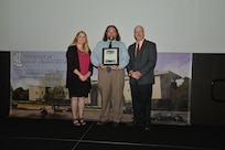 IMAGE: DAHLGREN, Va. (Sept. 21, 2018) – John Rigsby receives his certificate of achievement from Naval Surface Warfare Center Dahlgren Division (NSWCDD) Acting Chief of Staff Terri Gray and Acting Deputy Technical Director Chris Clifford at the 2018 NSWCDD Academic Recognition Ceremony.