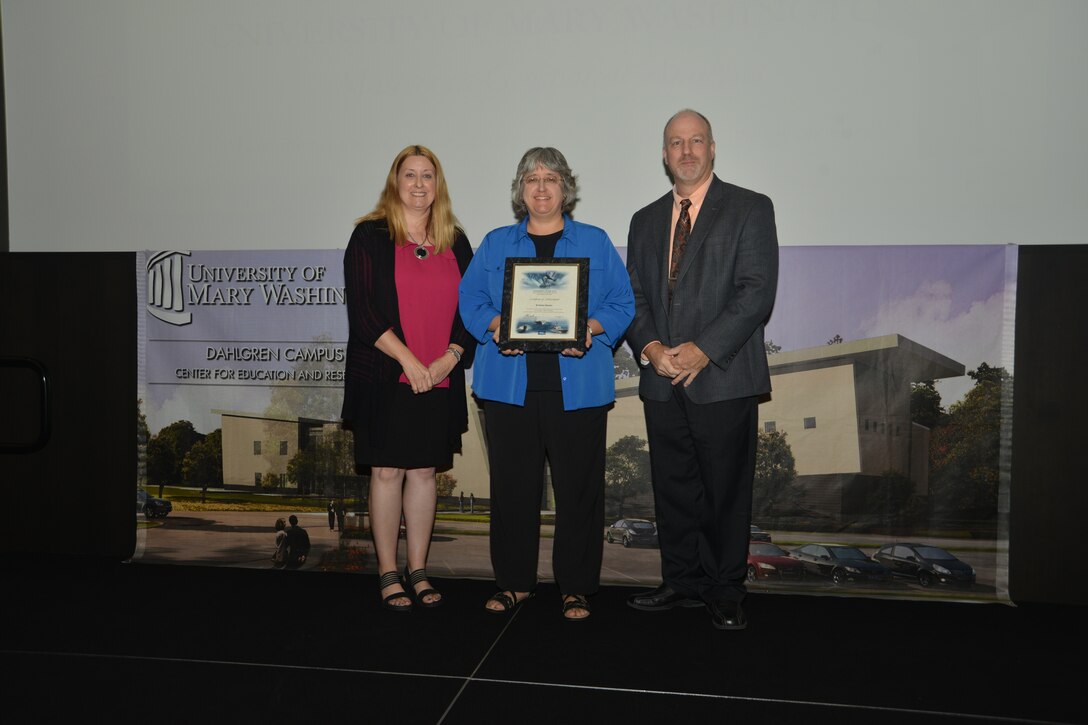 IMAGE: DAHLGREN, Va. (Sept. 21, 2018) – Kristine Hooks receives her certificate of achievement from Naval Surface Warfare Center Dahlgren Division (NSWCDD) Acting Chief of Staff Terri Gray and Acting Deputy Technical Director Chris Clifford at the 2018 NSWCDD Academic Recognition Ceremony.