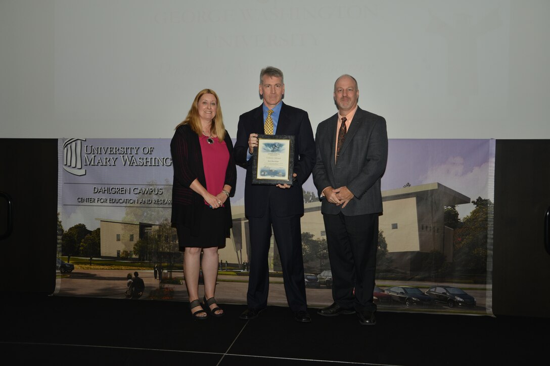IMAGE: DAHLGREN, Va. (Sept. 21, 2018) – Harry Dreany receives his certificate of achievement from Naval Surface Warfare Center Dahlgren Division (NSWCDD) Acting Chief of Staff Terri Gray and Acting Deputy Technical Director Chris Clifford at the 2018 NSWCDD Academic Recognition Ceremony.