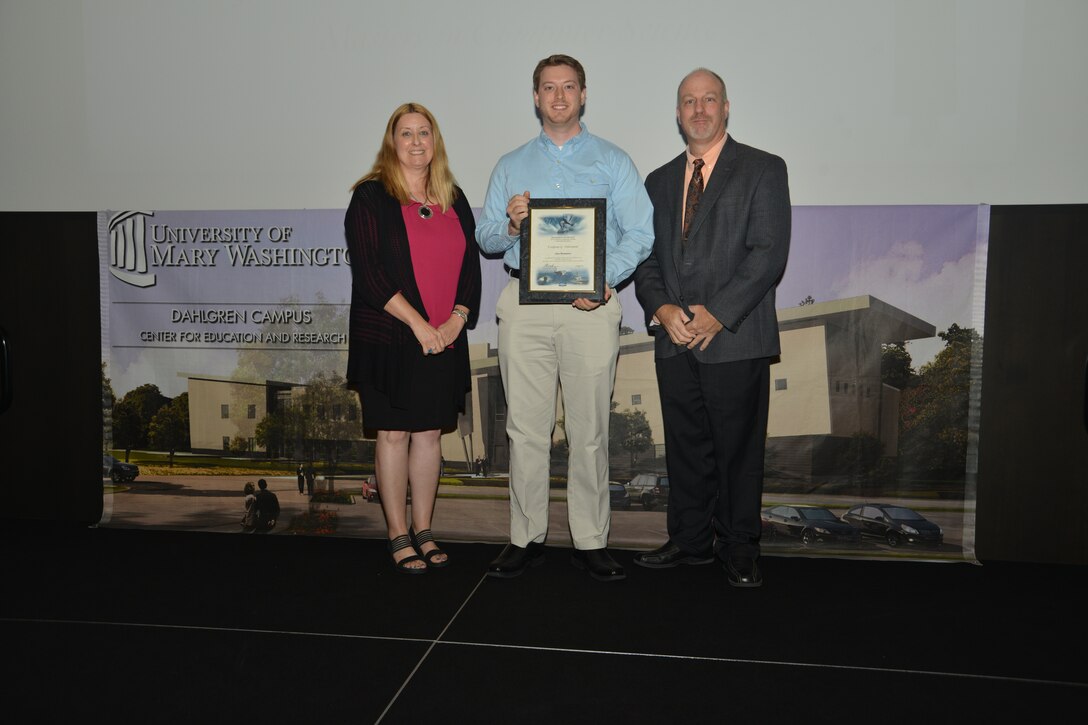 IMAGE: DAHLGREN, Va. (Sept. 21, 2018) – Alex Hammers receives his certificate of achievement from Naval Surface Warfare Center Dahlgren Division (NSWCDD) Acting Chief of Staff Terri Gray and Acting Deputy Technical Director Chris Clifford at the 2018 NSWCDD Academic Recognition Ceremony.