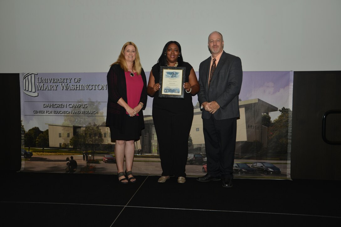 IMAGE: DAHLGREN, Va. (Sept. 21, 2018) – Quinnesha Staton receives her certificate of achievement from Naval Surface Warfare Center Dahlgren Division (NSWCDD) Acting Chief of Staff Terri Gray and Acting Deputy Technical Director Chris Clifford at the 2018 NSWCDD Academic Recognition Ceremony.