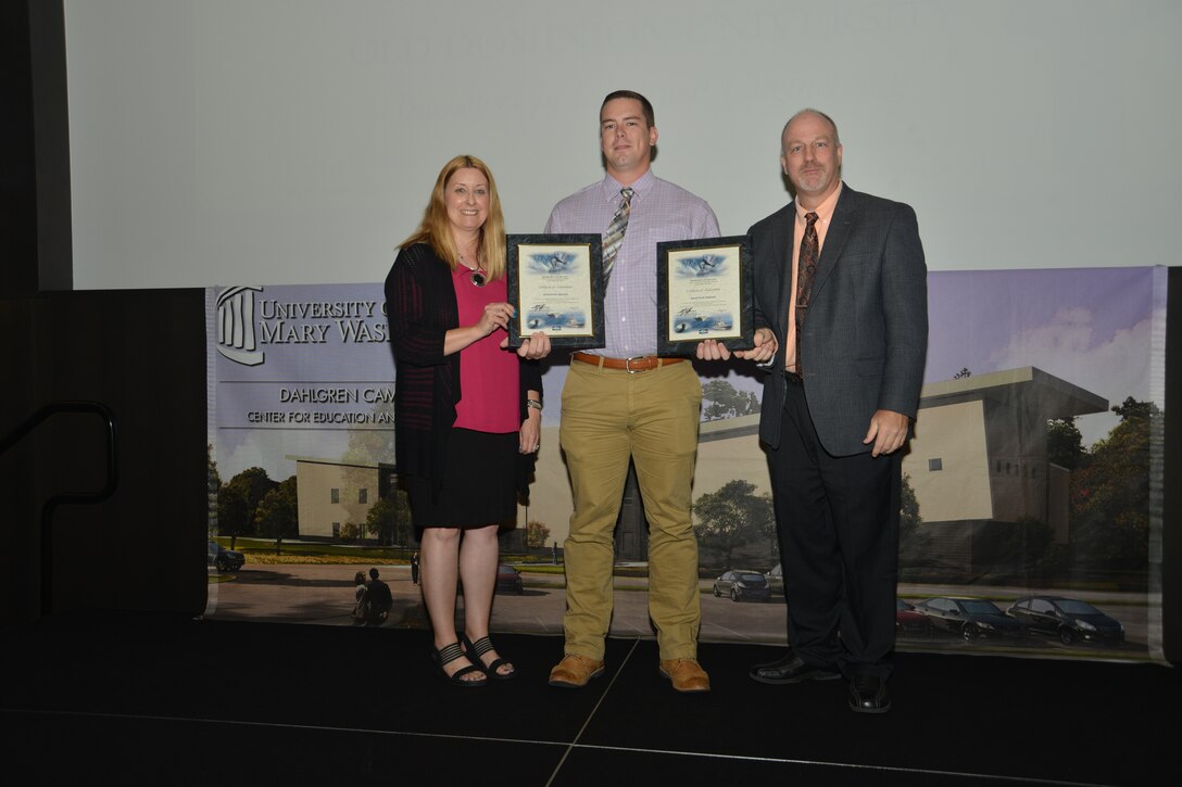 IMAGE: DAHLGREN, Va. (Sept. 21, 2018) – Jason Jameson receives his certificate of achievement from Naval Surface Warfare Center Dahlgren Division (NSWCDD) Acting Chief of Staff Terri Gray and Acting Deputy Technical Director Chris Clifford at the 2018 NSWCDD Academic Recognition Ceremony.