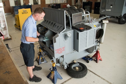 Jonathan Beres, 12th Flying Training Wing aerospace ground equipment mechanic, checks the oil levels on an aircraft New Generation Heater during routine maintenance Aug. 28, 2018, at Joint Base San Antonio-Randolph, Texas. Beres is part of a team that inspects, tests and maintains ground equipment that supports aircraft maintenance and flying training operations.