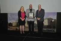 IMAGE: DAHLGREN, Va. (Sept. 21, 2018) – Lutcher Samuel III receives his certificate of achievement from Naval Surface Warfare Center Dahlgren Division (NSWCDD) Acting Chief of Staff Terri Gray and Acting Deputy Technical Director Chris Clifford at the 2018 NSWCDD Academic Recognition Ceremony.