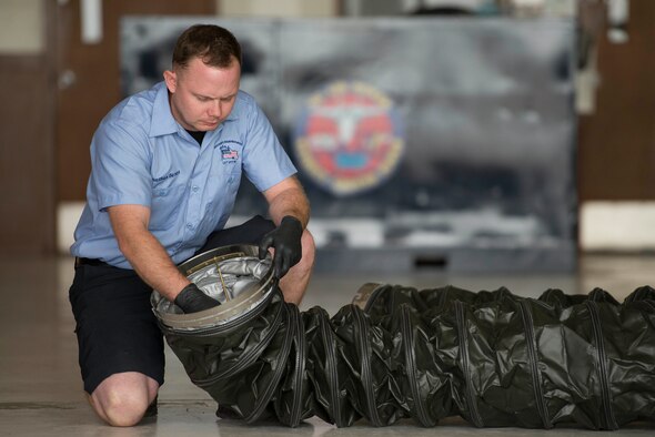 Jonathan Beres, 12th Flying Training Wing aerospace ground equipment mechanic, inspects the serviceability of a New Generation Heater duct during routine maintenance Aug. 28, 2018, at Joint Base San Antonio-Randolph, Texas. Beres is part of a team that inspects, tests and maintains ground equipment that supports aircraft maintenance and flying training operations.