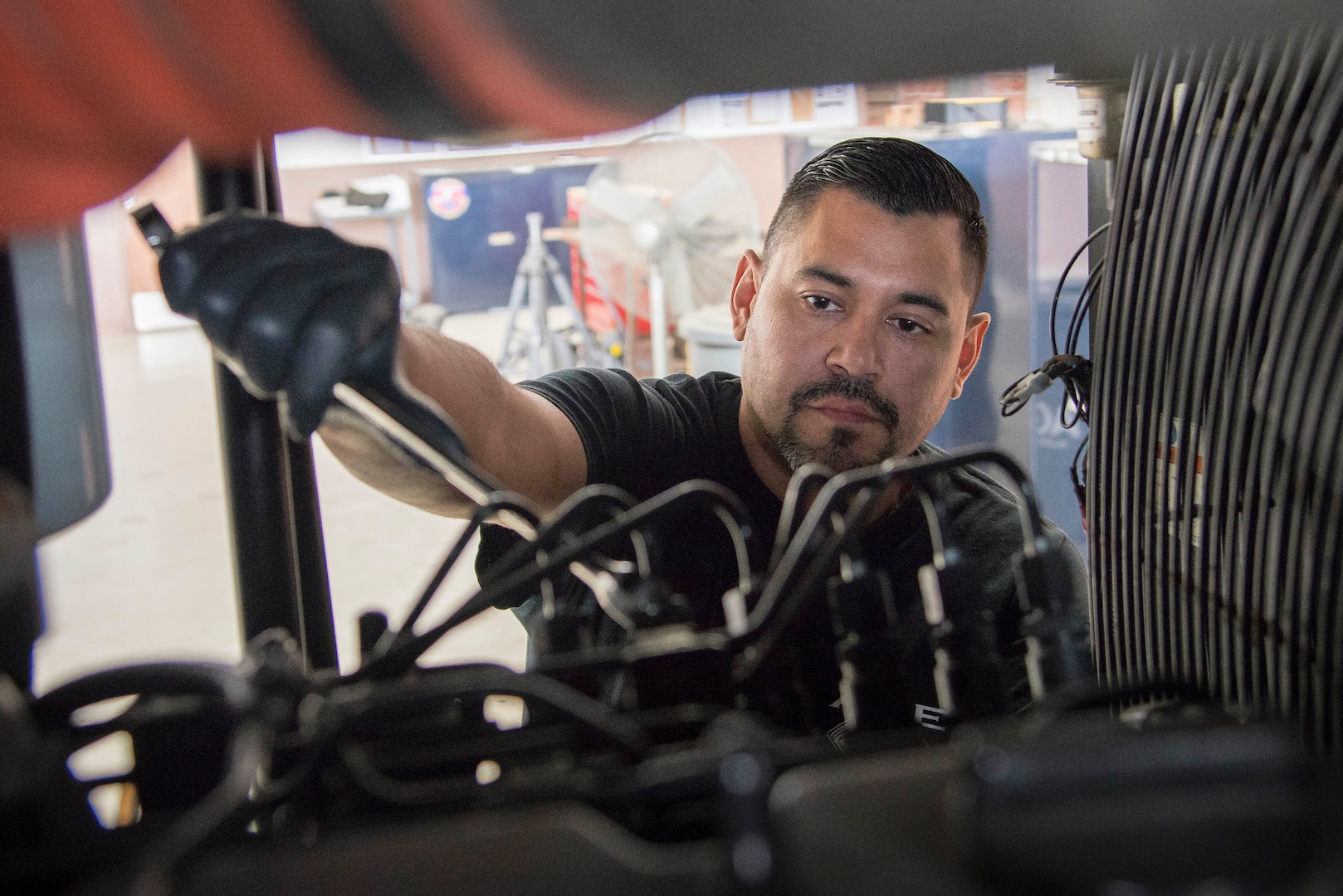 Zenon Torres, 12th Flying Training Wing aerospace ground equipment mechanic, performs routine maintenance on a MC-6 air compressor Aug. 28, 2018, at Joint Base San Antonio-Randolph, Texas. Torres is part of a team that inspects, tests and maintains ground equipment that supports aircraft maintenance and flying training operations.