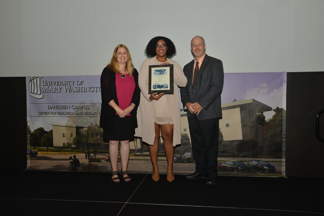 IMAGE: DAHLGREN, Va. (Sept. 21, 2018) – Tiffany Bailey receives her certificate of achievement from Naval Surface Warfare Center Dahlgren Division (NSWCDD) Acting Chief of Staff Terri Gray and Acting Deputy Technical Director Chris Clifford at the 2018 NSWCDD Academic Recognition Ceremony.