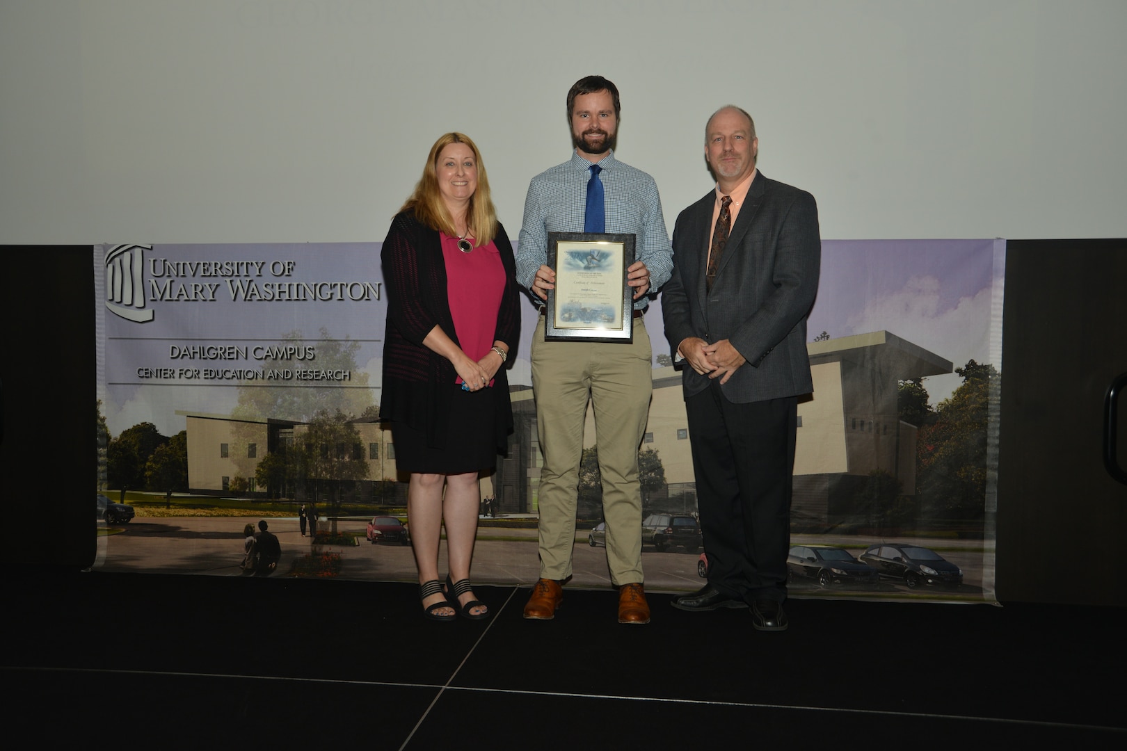 IMAGE: DAHLGREN, Va. (Sept. 21, 2018) – Joseph Carter receives his certificate of achievement from Naval Surface Warfare Center Dahlgren Division (NSWCDD) Acting Chief of Staff Terri Gray and Acting Deputy Technical Director Chris Clifford at the 2018 NSWCDD Academic Recognition Ceremony.