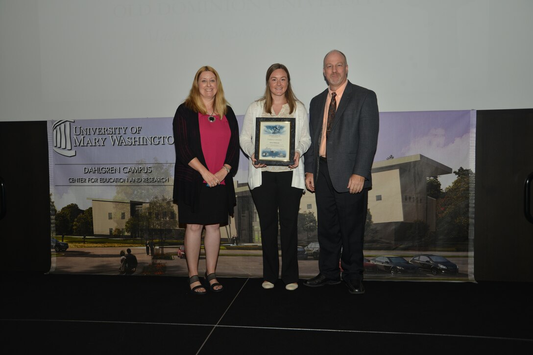 IMAGE: DAHLGREN, Va. (Sept. 21, 2018) – Jessica Hildebrand receives her certificate of achievement from Naval Surface Warfare Center Dahlgren Division (NSWCDD) Acting Chief of Staff Terri Gray and Acting Deputy Technical Director Chris Clifford at the 2018 NSWCDD Academic Recognition Ceremony.