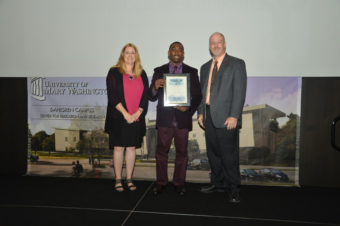IMAGE: DAHLGREN, Va. (Sept. 21, 2018) – Dwayne Nelson receives his certificate of achievement from Naval Surface Warfare Center Dahlgren Division (NSWCDD) Acting Chief of Staff Terri Gray and Acting Deputy Technical Director Chris Clifford at the 2018 NSWCDD Academic Recognition Ceremony.