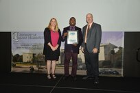 IMAGE: DAHLGREN, Va. (Sept. 21, 2018) – Dwayne Nelson receives his certificate of achievement from Naval Surface Warfare Center Dahlgren Division (NSWCDD) Acting Chief of Staff Terri Gray and Acting Deputy Technical Director Chris Clifford at the 2018 NSWCDD Academic Recognition Ceremony.