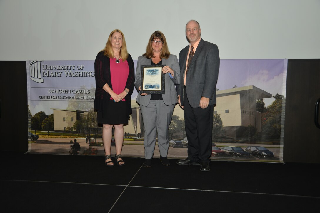 IMAGE: DAHLGREN, Va. (Sept. 21, 2018) – Cheryl Subacius receives her certificate of achievement from Naval Surface Warfare Center Dahlgren Division (NSWCDD) Acting Chief of Staff Terri Gray and Acting Deputy Technical Director Chris Clifford at the 2018 NSWCDD Academic Recognition Ceremony.