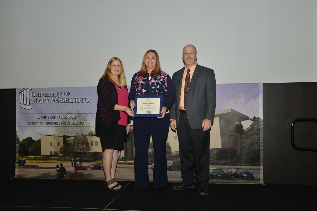 IMAGE: DAHLGREN, Va. (Sept. 21, 2018) – Doneen Phillips receives her certificate of appreciation from Naval Surface Warfare Center Dahlgren Division (NSWCDD) Acting Chief of Staff Terri Gray and Acting Deputy Technical Director Chris Clifford at the 2018 NSWCDD Academic Recognition Ceremony.