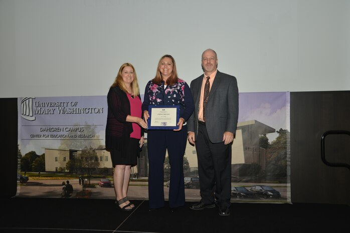 IMAGE: DAHLGREN, Va. (Sept. 21, 2018) – Doneen Phillips receives her certificate of appreciation from Naval Surface Warfare Center Dahlgren Division (NSWCDD) Acting Chief of Staff Terri Gray and Acting Deputy Technical Director Chris Clifford at the 2018 NSWCDD Academic Recognition Ceremony.
