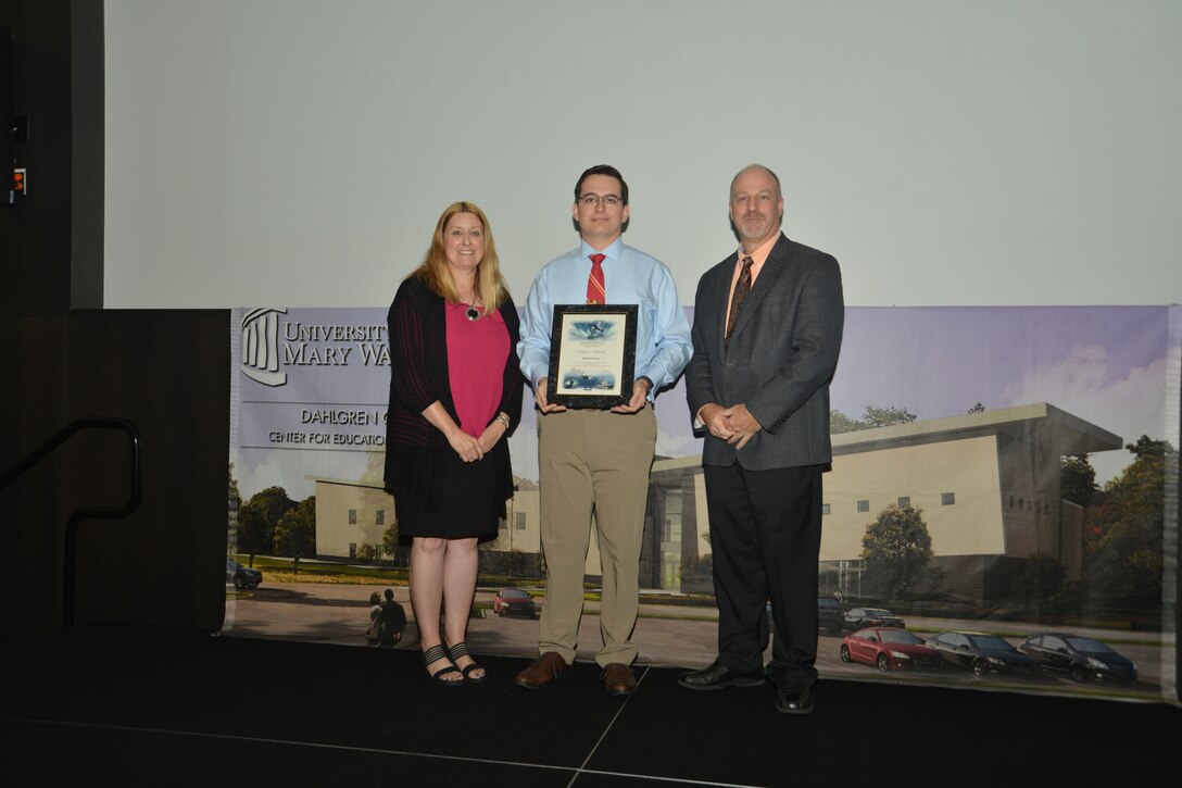 IMAGE: DAHLGREN, Va. (Sept. 21, 2018) – Michael Parsons receives his certificate of achievement from Naval Surface Warfare Center Dahlgren Division (NSWCDD) Acting Chief of Staff Terri Gray and Acting Deputy Technical Director Chris Clifford at the 2018 NSWCDD Academic Recognition Ceremony.