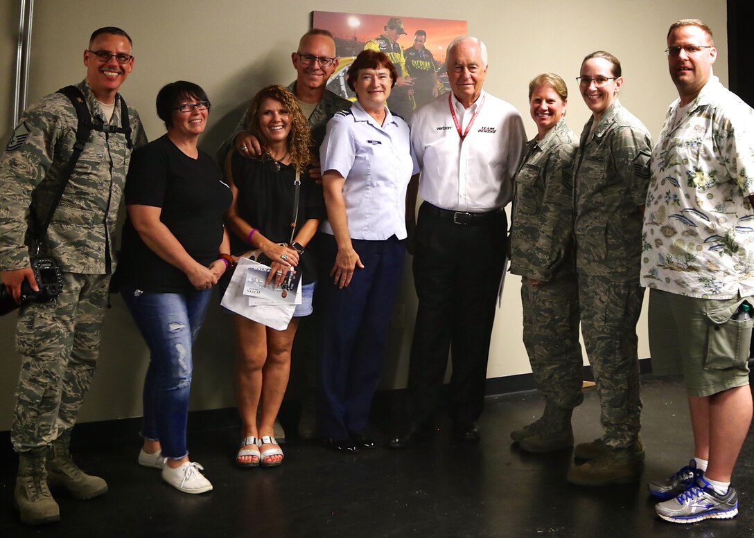 Roger Penske (center in white shirt) welcomed 932nd Airlift Wing members and family to the Gateway race track recently.  The "Captain" has been racing and winning in the United States since 1958 and has scored victories in every series where he has competed. With 32 national championships, including 15 in Indy car racing, Penske Racing has often been referred to as the "New York Yankees of motorsports."  As part of the event, 932nd Airlift Wing Maintenance Group commander, Col. Sharon Johnson (at left of Penske), was recognized on stage with the Indy drivers at the Bommarito Automotive Group 500 Aug. 25, 2018, Gateway Motorsports Park, Madison, Illinois. Johnson was an honored VIP to help kick off the 2nd annual IndyCar race which was won by Will Power,  won the 248-lap race around the four-turn, 1.25-mile Gateway Motorsports Park oval paved track in Madison, Illinois, in his #12 Chevrolet by 1.3117 seconds over second place finisher Alexander Rossi.  The 932nd Airlift Wing was represented by maintenance, medical, public affairs staff and operations personnel.  (U.S. Air Force photo by Lt. Col. Stan Paregien)