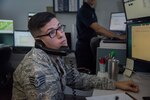 Staff Sgt. Aleen Roby, noncommissioned officer in charge of dispatch with the 502nd Civil Engineer Group, responds to a 911 emergency call on Joint Base San Antonio-Randolph, Texas, Oct. 3, 2018. 911 dispatchers on base work out of the Emergency Control Center in building 237. (U.S. Air Force photo by Airman Shelby Pruitt)