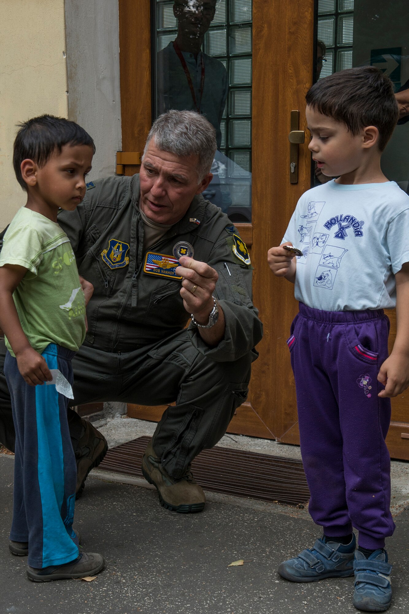 U.S. Air Force Reserve Col. Robert VanHoy, 307th Bomb Wing commander, gives a wing coin to a boy at the Children’s Center orphanage on Sept. 13, 2018, Ostrava, Czech Republic. The children’s home is a nongovernment medical organization with a nonstop service and is designed generally for children ages new born to 3. (U.S. Air Force photo by Master Sgt. Greg Steele)