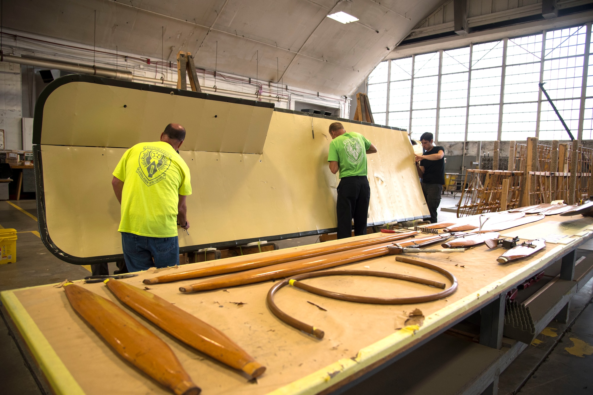 DAYTON, Ohio -- Museum restoration specialists remove wing fabric on the Avro 504K which was originally built in 1966 by the Royal Canadian Air Force's Aircraft Maintenance & Development Unit. Preserving the Air Force's proud legacy, the Restoration Division restores aircraft and aerospace vehicles to historically accurate and visually striking levels. (U.S. Air Force photo by Ken LaRock)