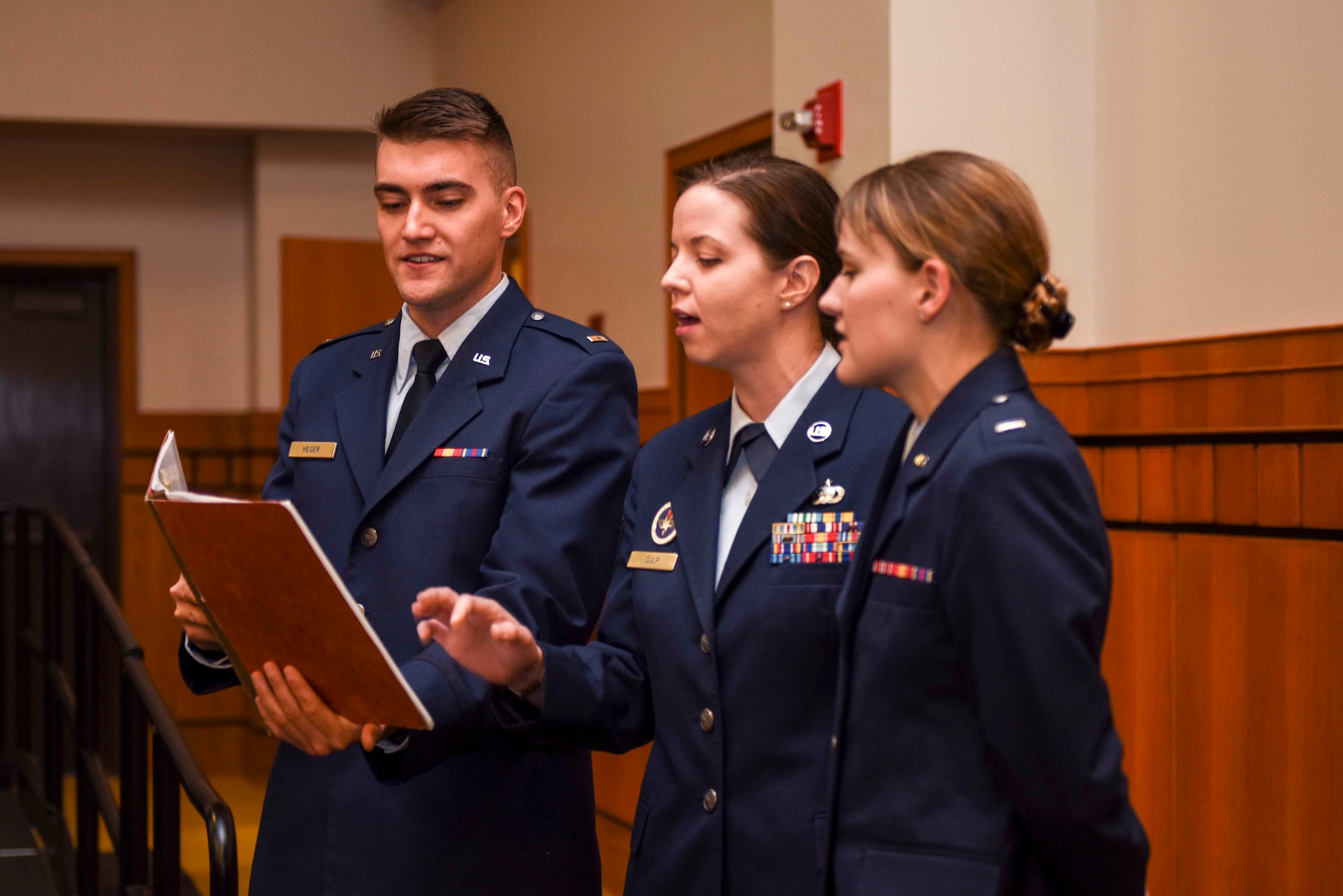 Members of Patriotic Blue, 2nd Lt. Alexander Heger, 315th Training Squadron student, TSgt Starla Culp, 315th TRS instructor, and 1st Lt Kaitlyn Sprague, 315th TRS student, sing “America the Beautiful” during the naturalization ceremony held at the CJ Davidson Center on Angelo State University, San Angelo, Texas. The ceremony naturalized 76 individuals from 13 different countries.  (U.S. Air Force photo by Aryn Lockhart/Released)