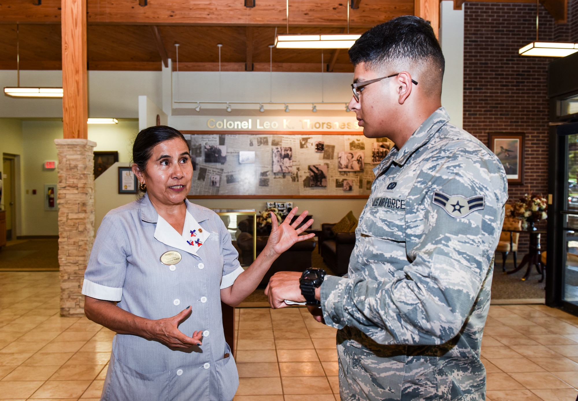 Angelo Inn housekeeper, Rosa Drake, tells her naturalization story to U.S. Air Force Airman 1st Class Matthew Angulo, 17 TRW Public Affairs broadcaster, Sept. 24, 2018 at the Valor Inn on Goodfellow Air Force Base, Texas.  Drake took classes through a partnership agreement between Howard College and Goodfellow. (U.S. Air Force photo by Aryn Lockhart/Released)
