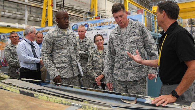 Joseph Gardenhour (right), 573rd Aircraft Maintenance Squadron director, speaks with Lt. Gen. Gene Kirkland, Air Force Sustainment Center commander, and other leaders during the general's site visit Oct. 2, 2018, at Hill Air Force Base, Utah. (U.S. Air Force photo by R. Nial Bradshaw)