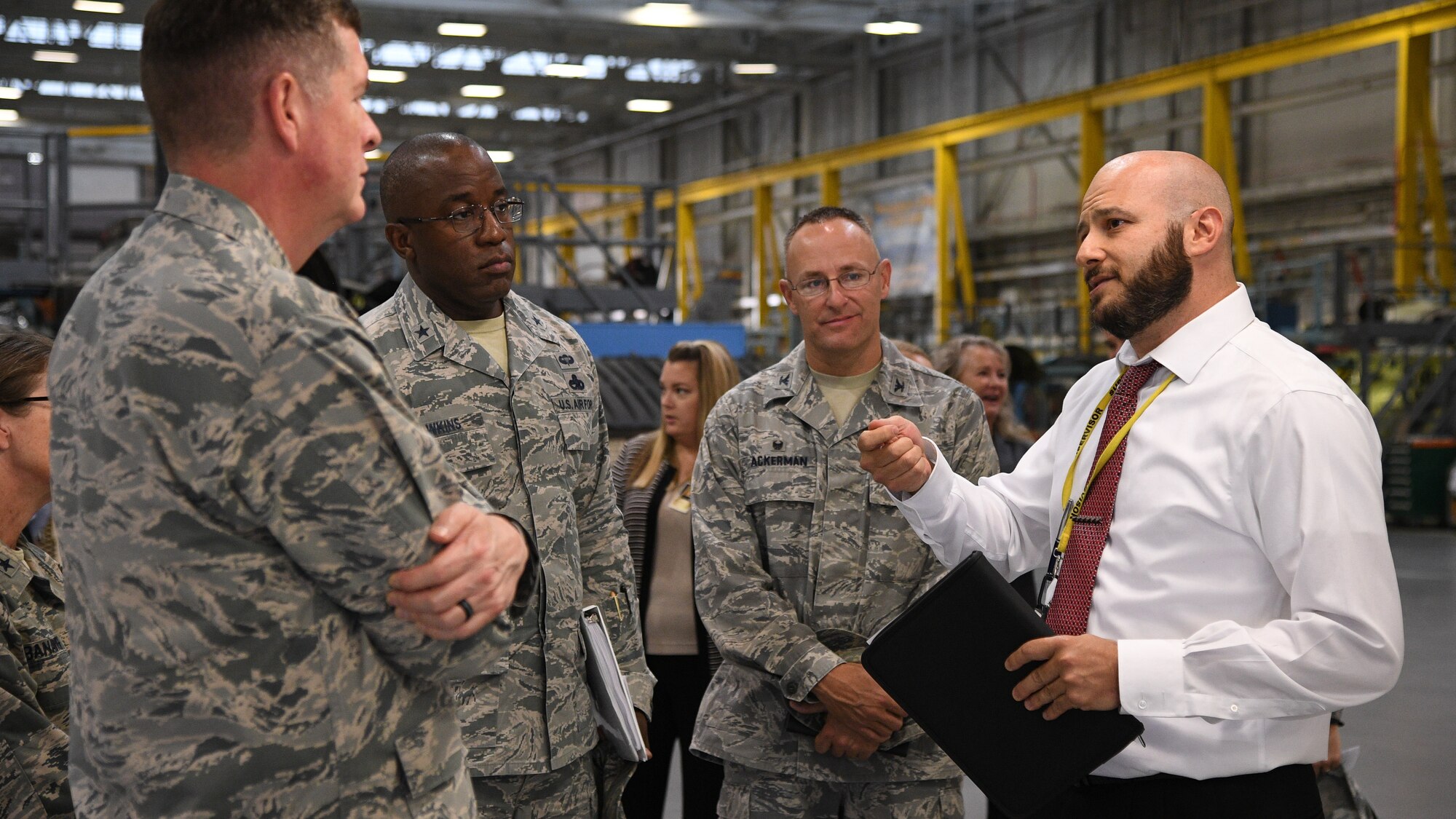 Gene Kourtei (right), 572nd Aircraft Maintenance Squadron director, speaks with Lt. Gen. Gene Kirkland, Air Force Sustainment Center commander, and other leaders during the general's site visit Oct. 2, 2018, at Hill Air Force Base, Utah. (U.S. Air Force photo by R. Nial Bradshaw)