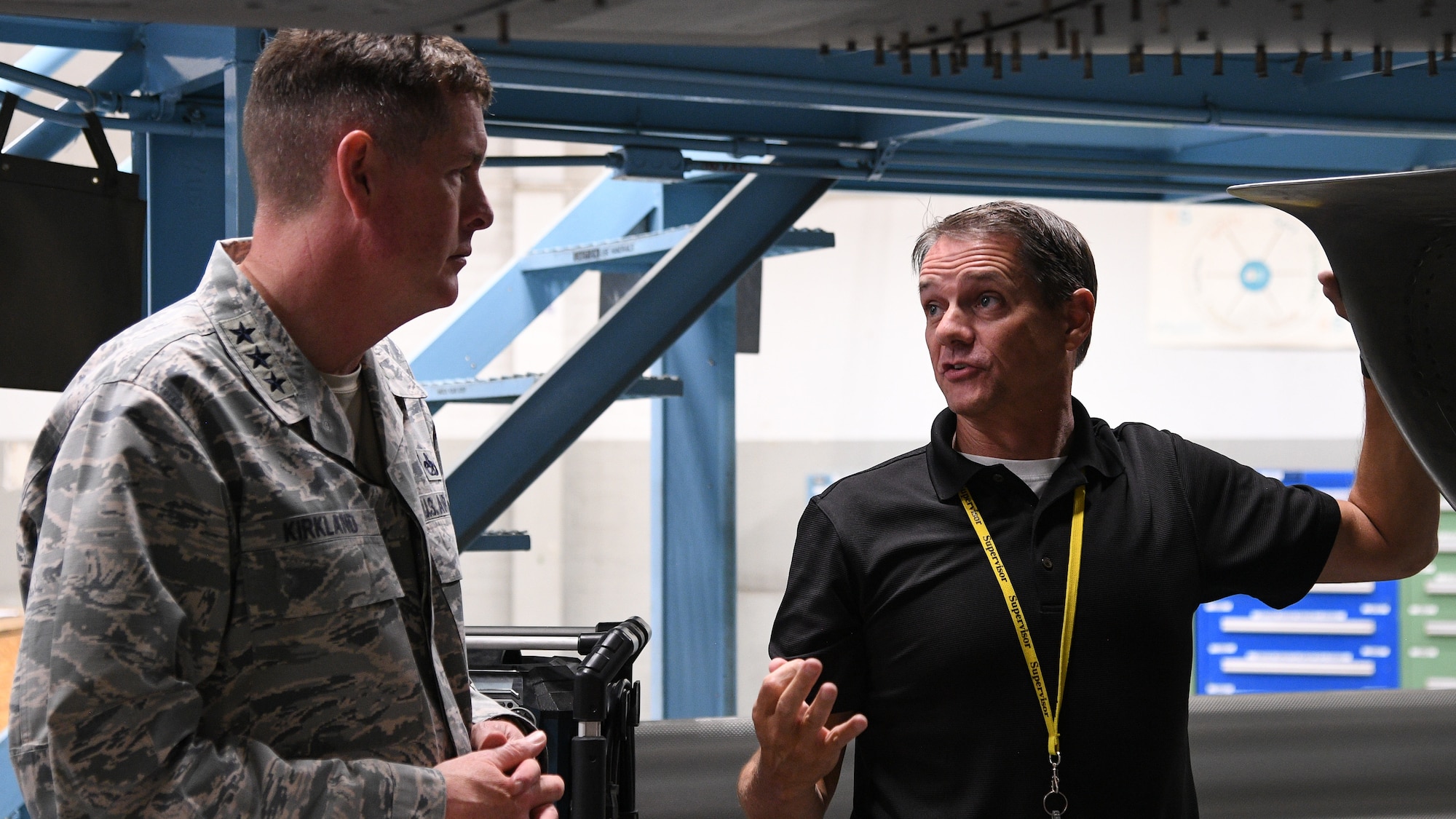Joseph Gardenhour(right), 573rd Aircraft Maintenance Squadron director, speaks with Lt. Gen. Gene Kirkland, Air Force Sustainment Center commander, during thje general's site visit Oct. 2, 2018, at Hill Air Force Base, Utah. (U.S. Air Force photo by R. Nial Bradshaw)