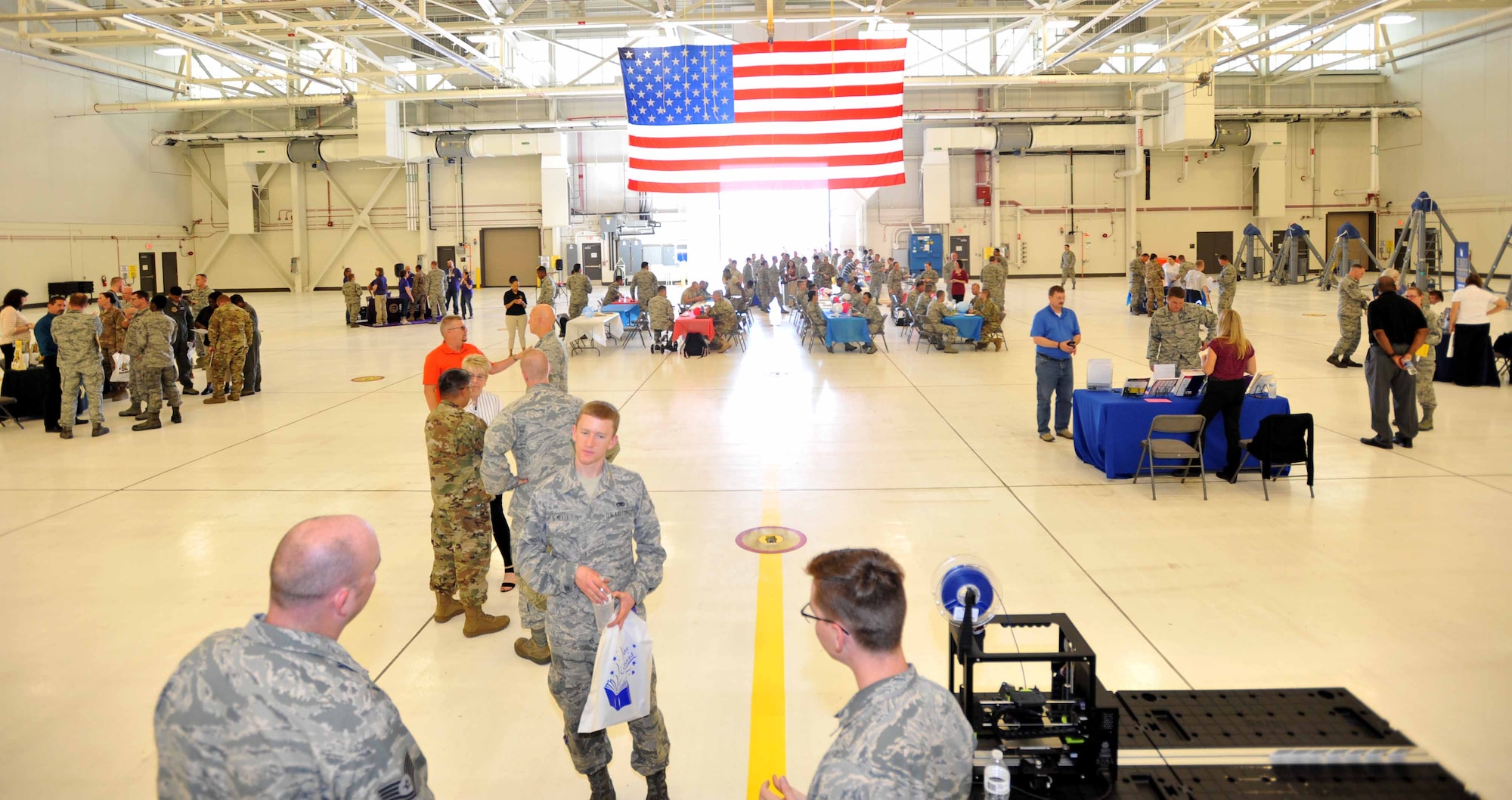 Airmen eat barbeque during the education fair Oct. 2, 2018, at McConnell Air Force Base, Kansas. The education fair offered free lunch on top of education opportunities to all Airmen that attended.