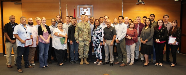 U.S. Army Corps of Engineers Los Angeles District employees pose for a picture after receiving Year-End Hero awards during the LA District’s End-of-the-Year celebration Oct. 3 at the District’s headquarters office in downtown Los Angeles. The annual event acknowledges employee achievements leading up to the Sept. 30 end-of-the-fiscal-year deadline.