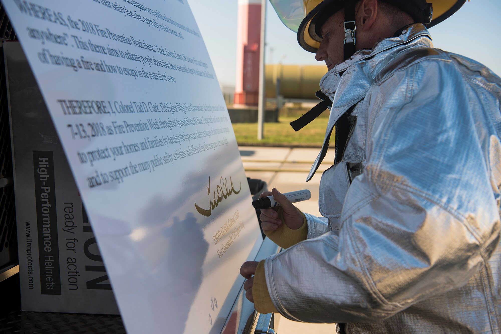 U.S. Air Force Col. Tad Clark, 52nd Fighter Wing vice commander, signs the Fire Prevention Week proclamation letter at Spangdahlem Air Base, Germany, Oct. 4, 2018. Every acting U.S. president has signed a fire prevention proclamation letter since 1925, and Clark continued the tradition as a commemoration. The theme of this year's event is, "Look, listen, learn. Be aware, fire can happen anywhere."  (U.S. Air Force photo by Airman 1st Class Valerie Seelye)