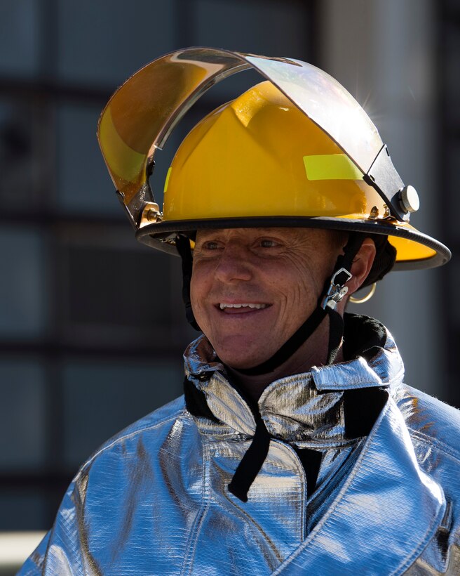 U.S. Air Force Col. Tad Clark, 52nd Fighter Wing vice commander, participates in live-fire structural burn training at Spangdahlem Air Base, Germany, Oct. 4, 2018. The training was part of a distinguished visitor emersion visit at the base fire department to kick off Fire Prevention Week. The event gave Spangdahlem personnel opportunities to learn how to identify and correct a fire hazard. (U.S. Air Force photo by Airman 1st Class Valerie Seelye)
