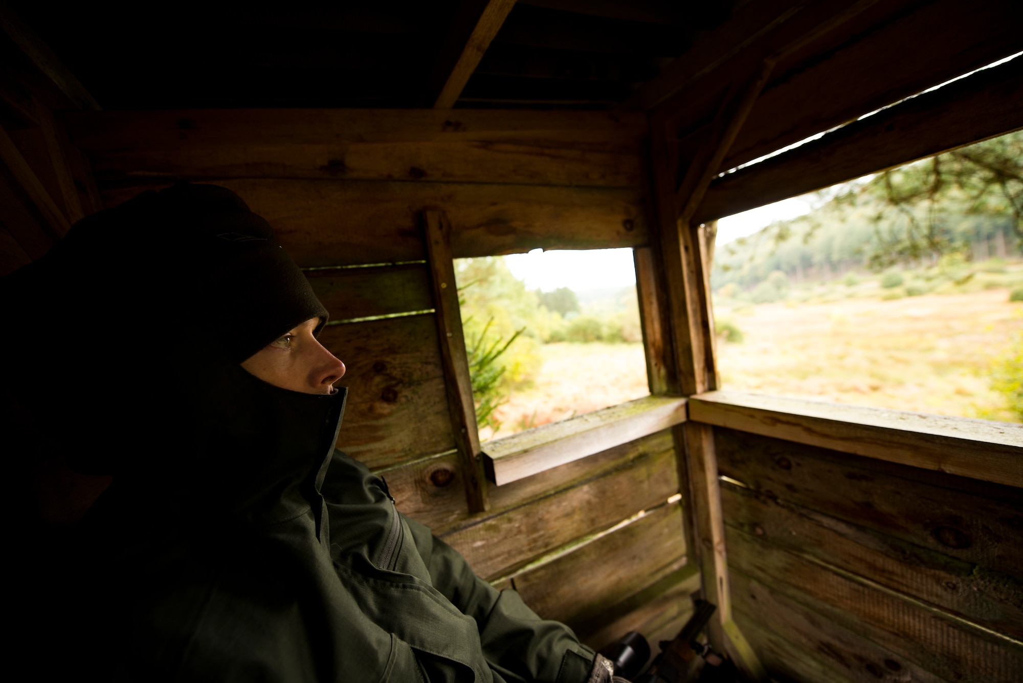 U.S. Air Force Maj. Nathan Waters, 603rd Air Operations Center cyberspace warfare operations chief, waits in a tree stand while hunting outside Kaiserslautern, Germany, Oct. 2, 2018. Because scientists found boar infected with African Swine Fever in Belgium, the Forestry Departments in Germany loosened regulations regarding boar hunting in an effort to stay ahead of the virus should it come into Germany. (U.S. Air Force photo by Staff Sgt. Jonathan Bass)